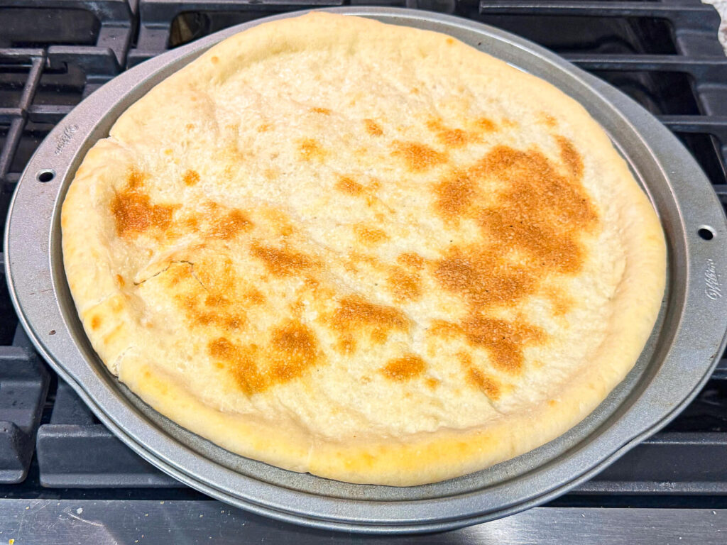 photo of prepared pizza crust 