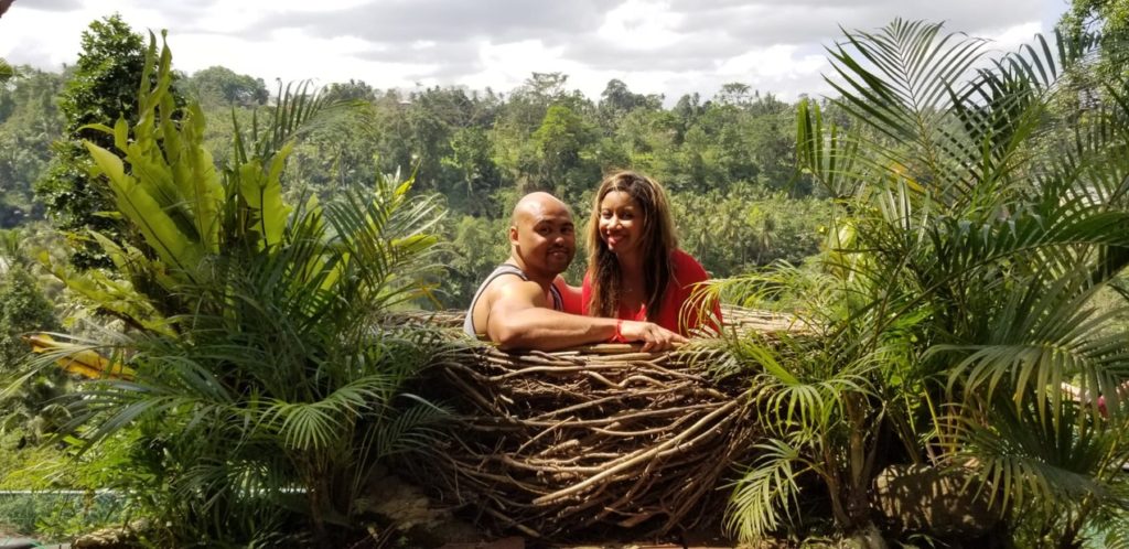 A photo of a couple inside a nest at the bali swing 