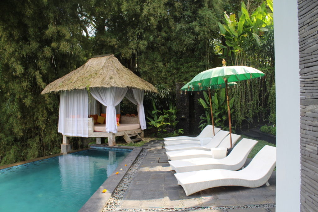 photo of bali umbrellas by the pool in Ubud, Bali