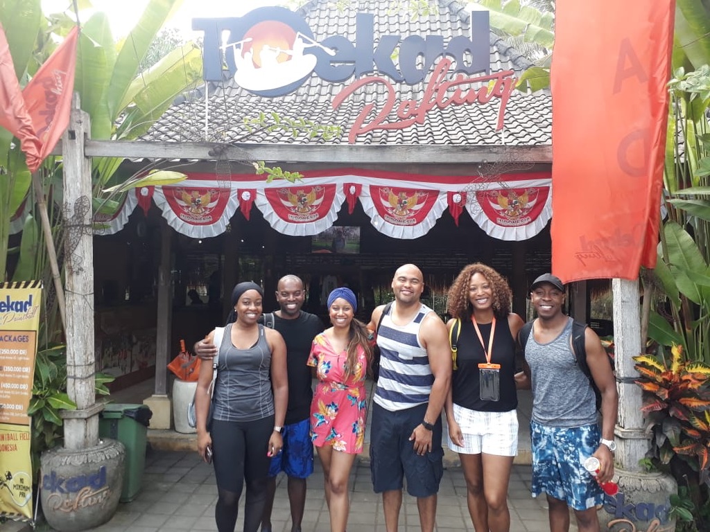 a photo of a group of people taking a photo in bali in front of the quad biking tour building