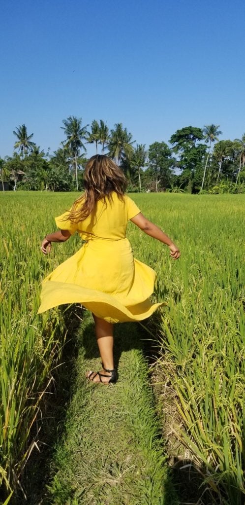 Photo of Elicit Folio in a yellow dressing running outside the restaurant of Bebek Bengil