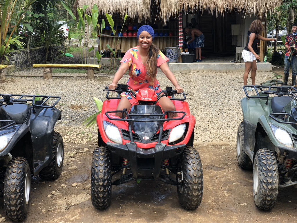 a photo of a couple overlooking the jungle while on their quad biking tour in Ubud Bali