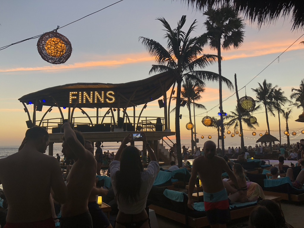 A photo of the Finns Beach Club sign on the beach in Seminyak, Bali