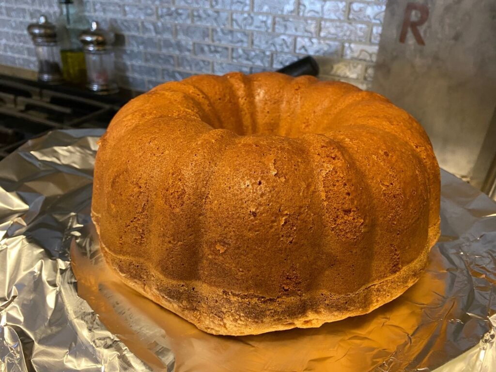 Cream Cheese Pound Cake Family Recipe! Elicit Folio. Photo of Cooked pound cake resting on foil to hold in moisture
