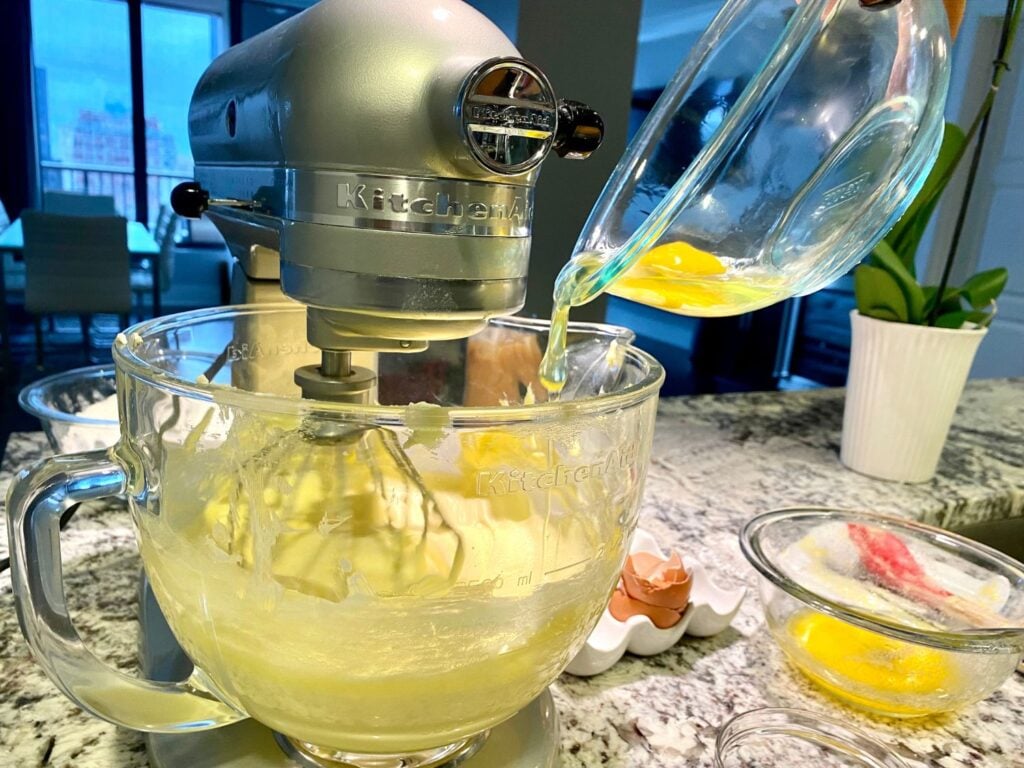 Cream Cheese Pound Cake Family Recipe! Elicit Folio. Photo of eggs being added to stand mixer