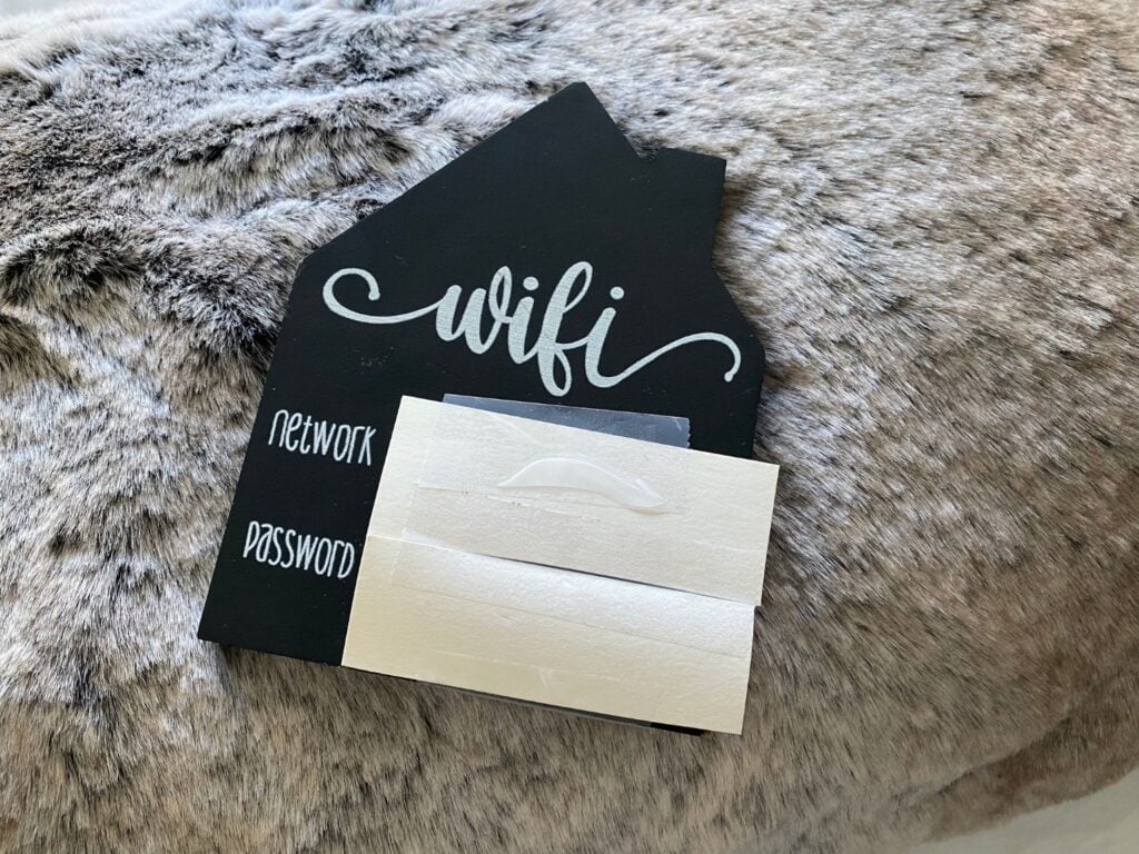 Photo of wifi password sign for guest bedroom