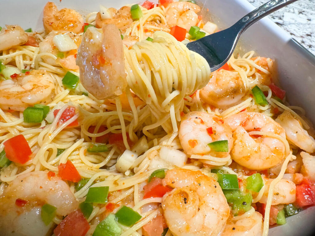 photo of shrimp pasta salad on a fork