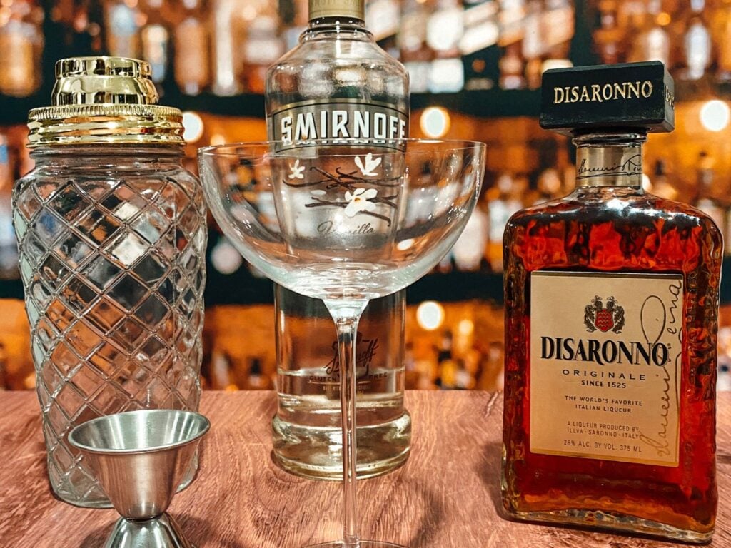 Photo of coupe glass, vodka and almond flavor liquor