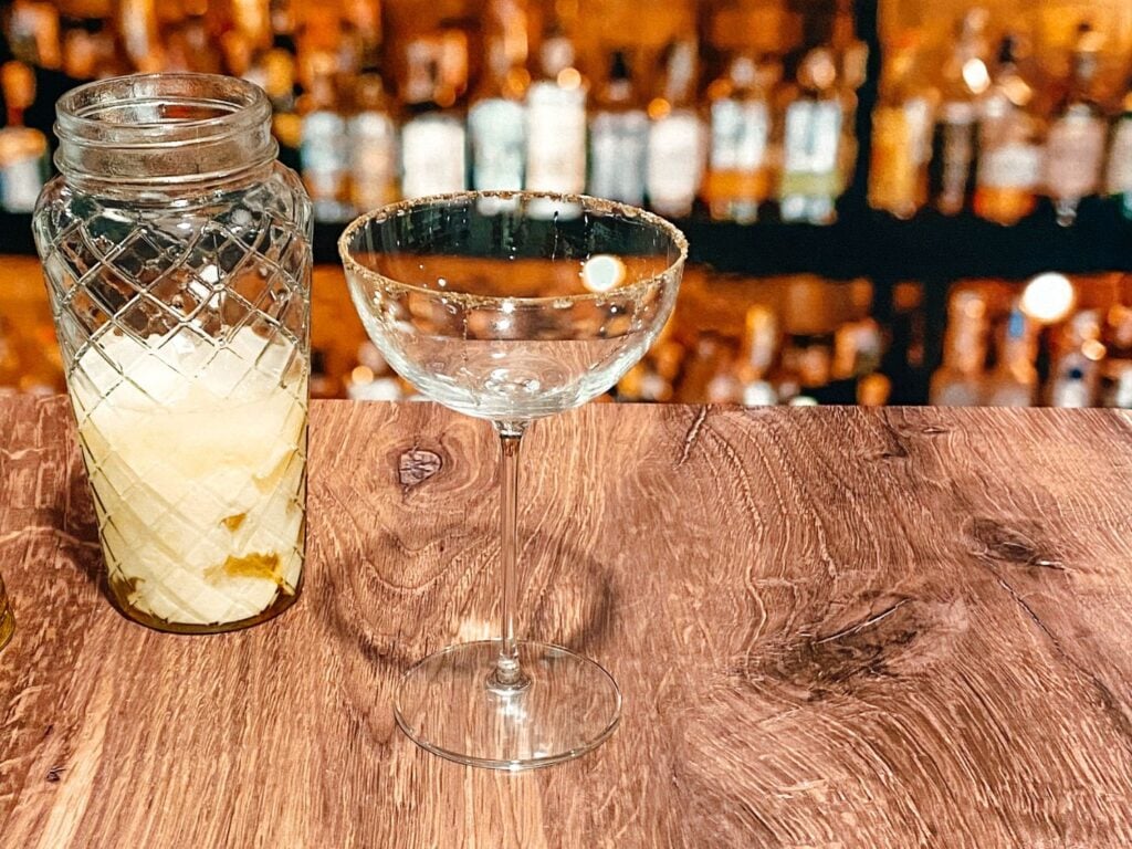 Photo of eggnog and alcohol mixture in coupe glass