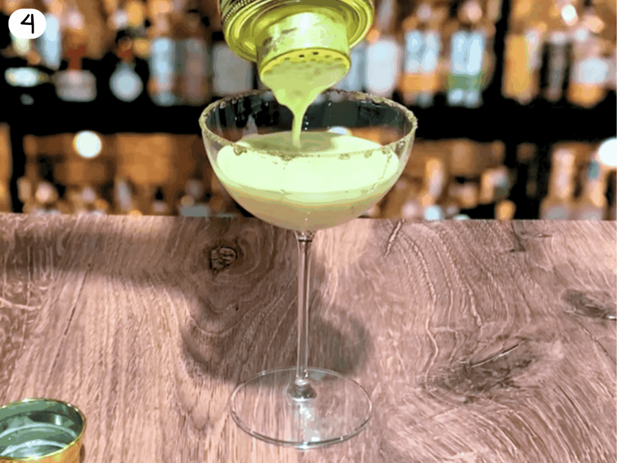 step 4 photo showing eggnog cocktail being poured in a glass