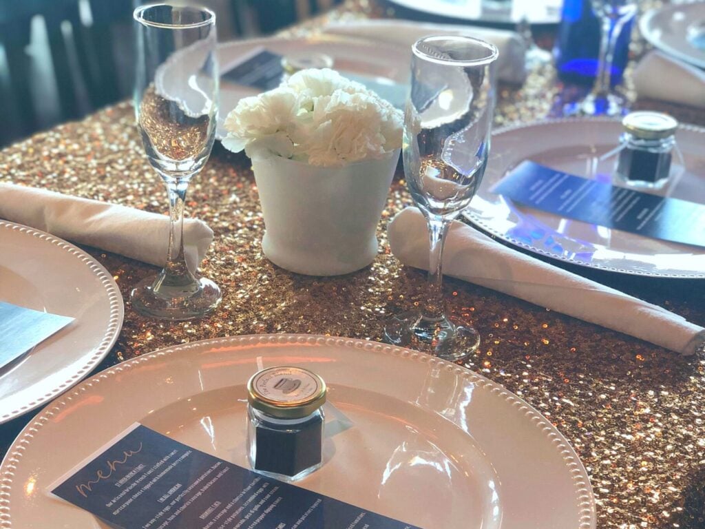 Photo of gold charger plates on sequin table