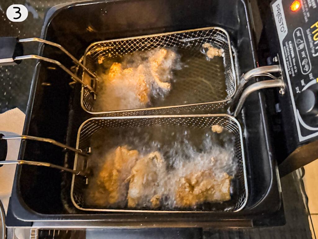 Photo of fried fish in deep fryer