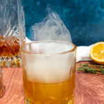 Photo of smoked bourbon lemon thyme cocktail