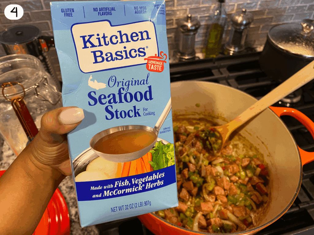 photo of seafood stock being added to the pot