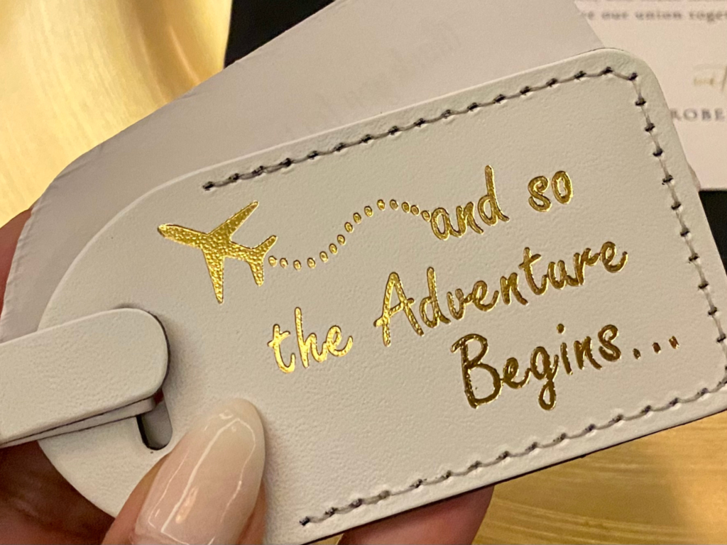 Photo of luggage tag favor at destination wedding planning tips
