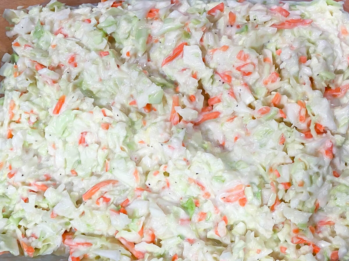 overhead photo of coleslaw in a glass dish
