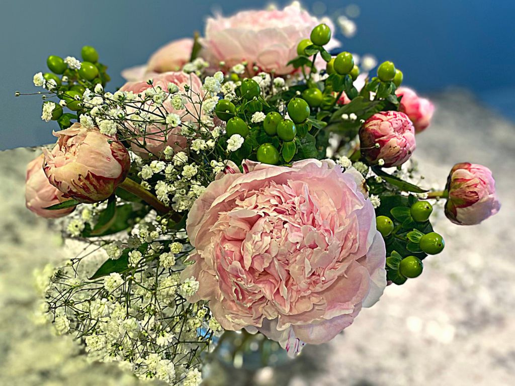 photo of peonies in flower arrangement
