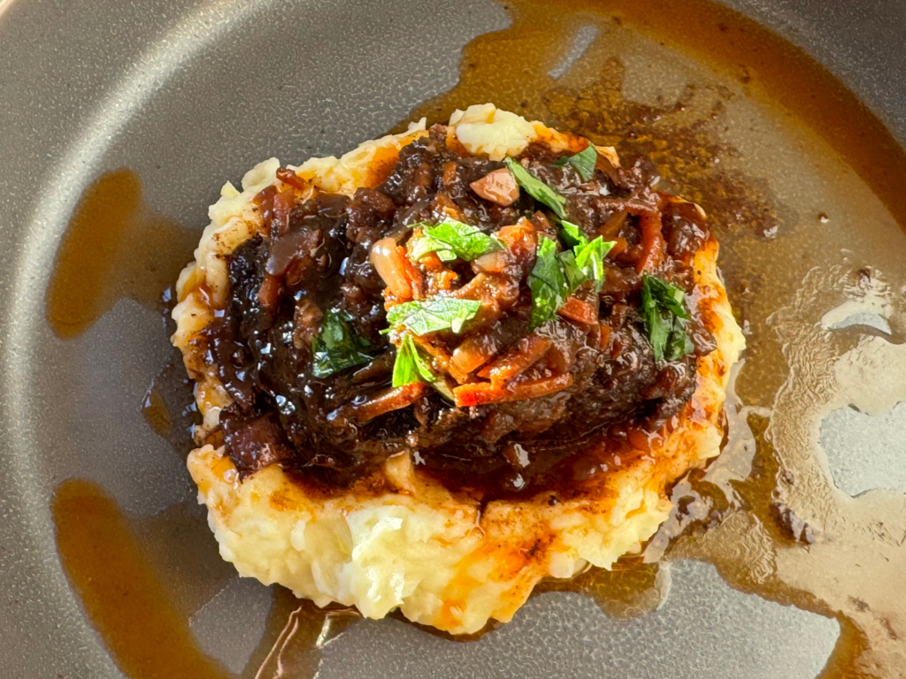 photo of cooked braised beef short ribs in red wine reduction sauce