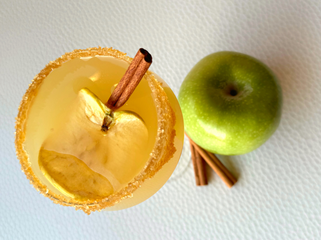 close look at caramel apple martini garnishes on glass