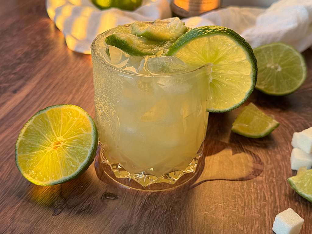 Photo of a Caipirinha Cocktail with lime wedges