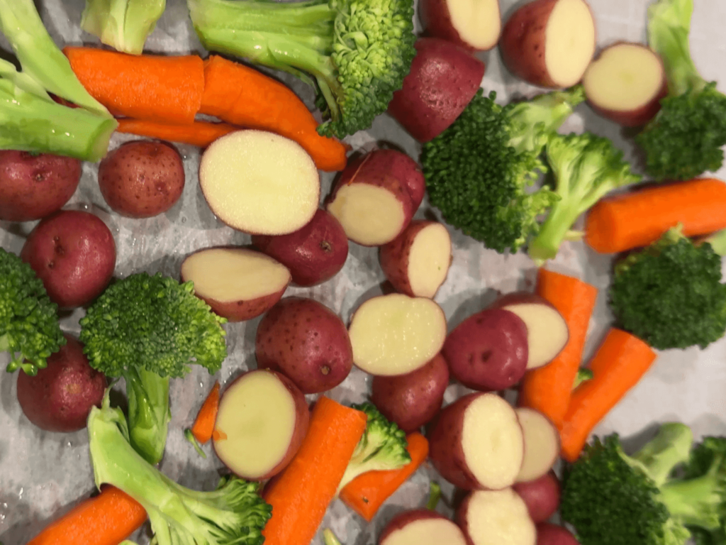 Photo of oven roasted carrots, broccoli, and baby red potatoes