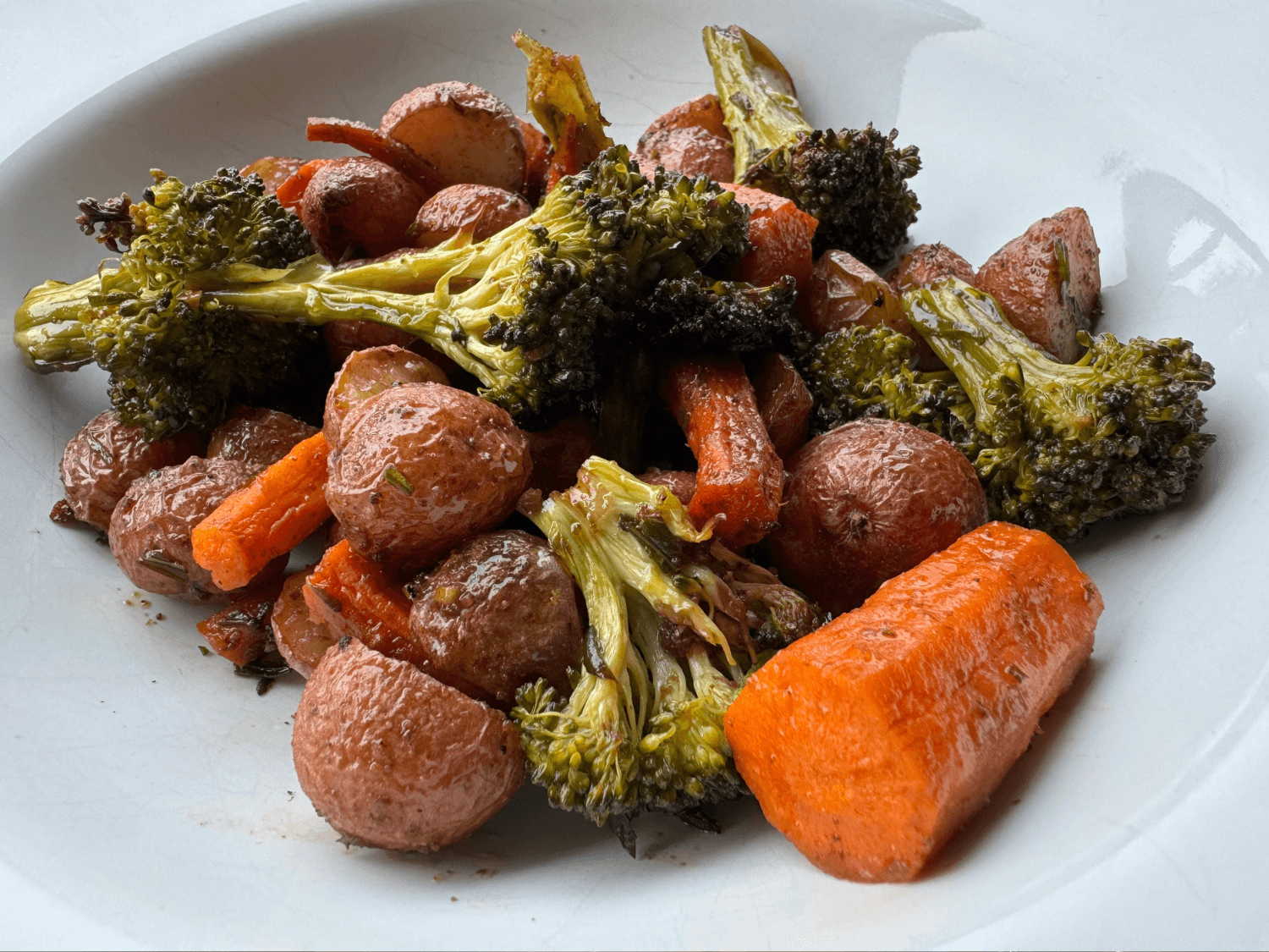 Photo of oven roasted carrots, broccoli, and baby red potatoes