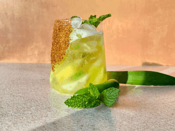 Photo of a spicy pineapple margarita with a mint garnish