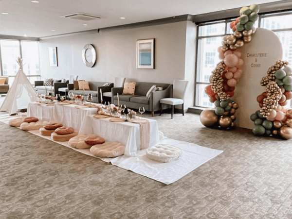 Photo of an indoor charcuterie and wine picnic
