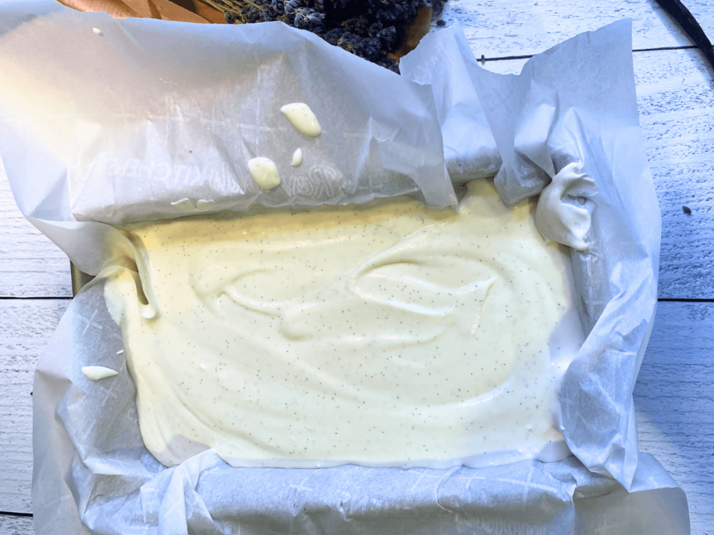 photo of lavender ice cream mixture in a loaf pan before it goes in the freezer