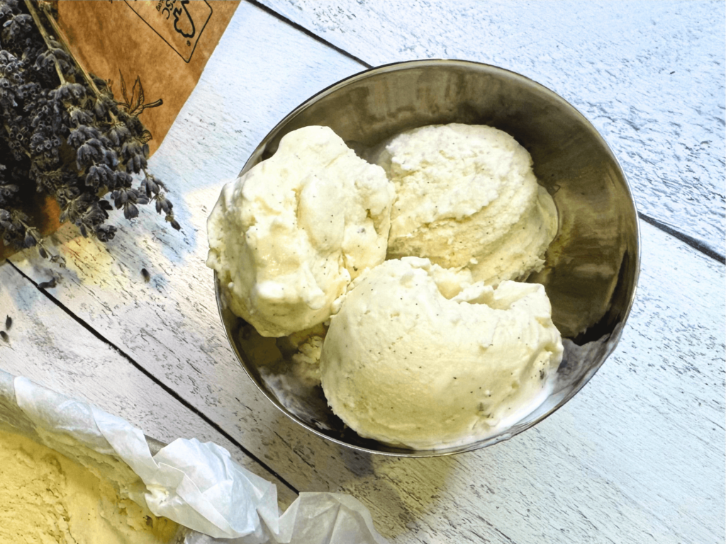 close up photo of lavender ice cream in a bowl