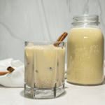 photo of homemade spiked eggnog in a glass and mason jar