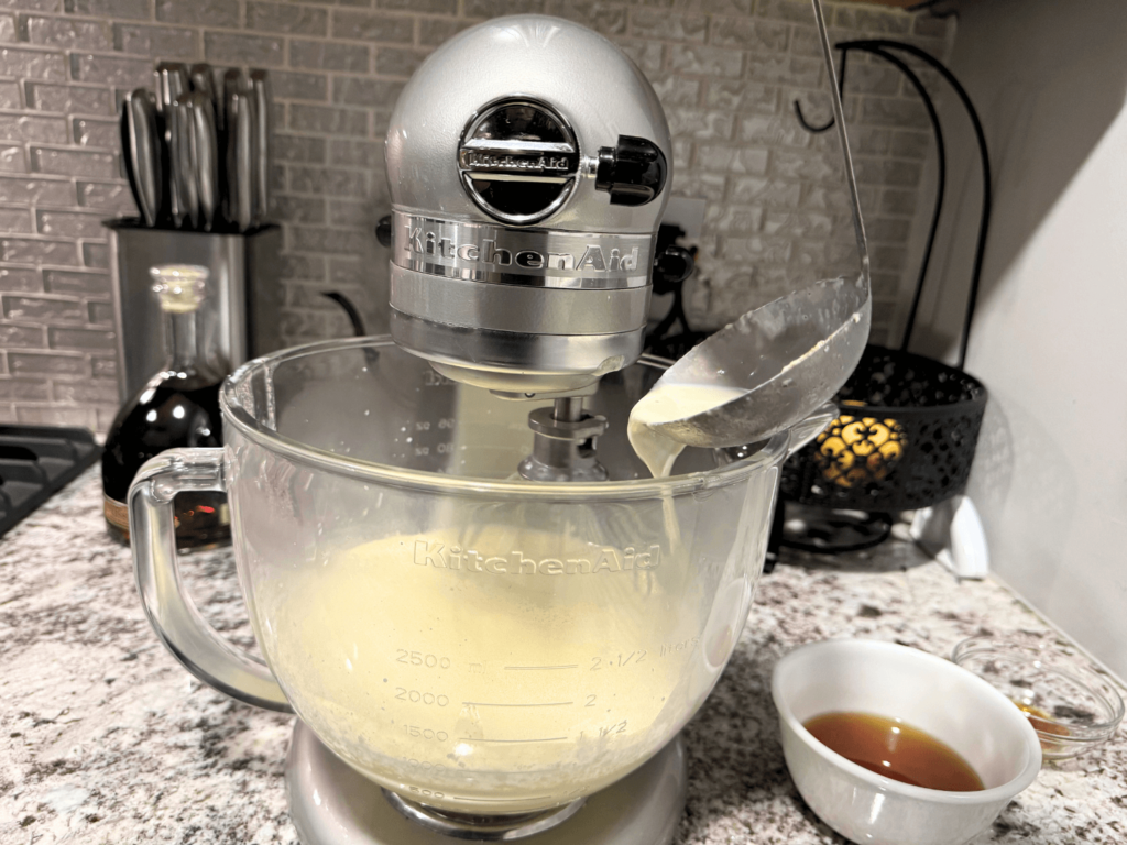 photo of egg sugar mixture and milk in mixer to make eggnog