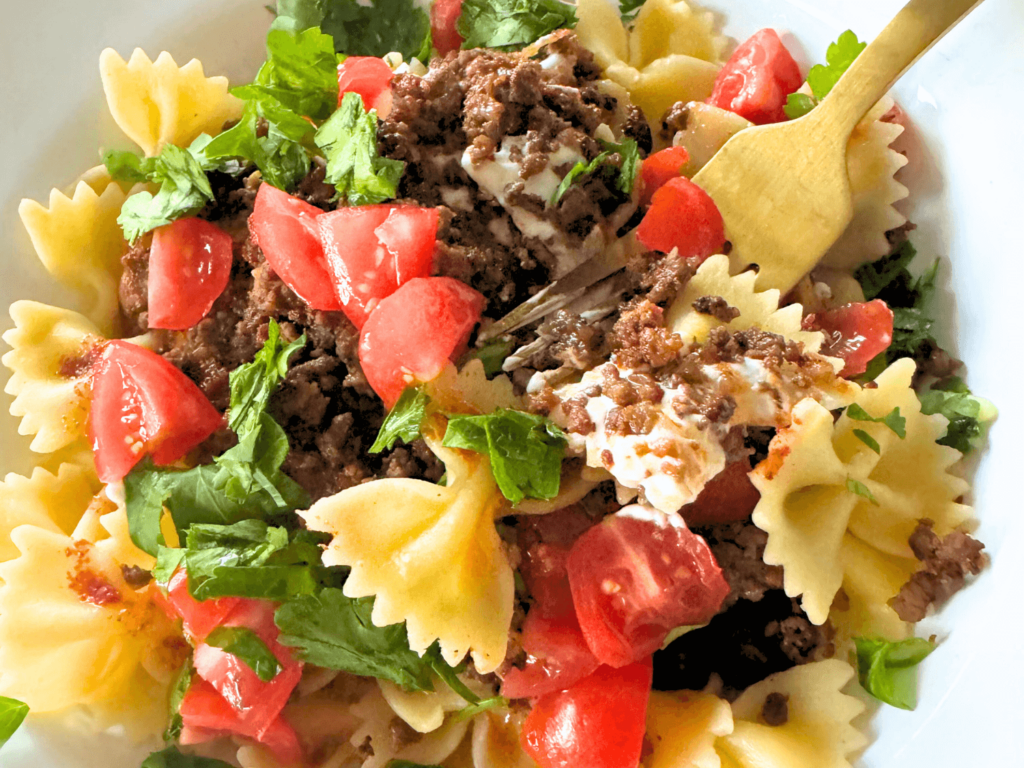 Photo of Turkish pasta (Yalancı Mantı) in a white bowl