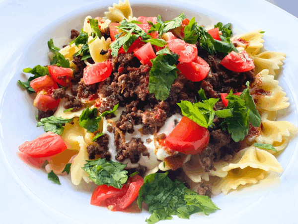 Photo of Turkish pasta (Yalancı Mantı) in a white bowl