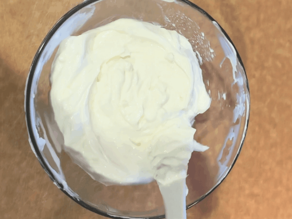 up close photo of yogurt sauce that goes on the Turkish pasta