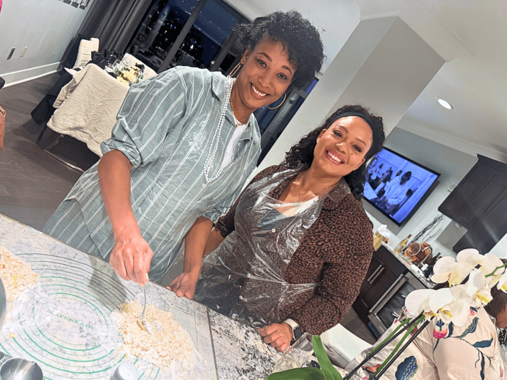 photo of two women making pasta