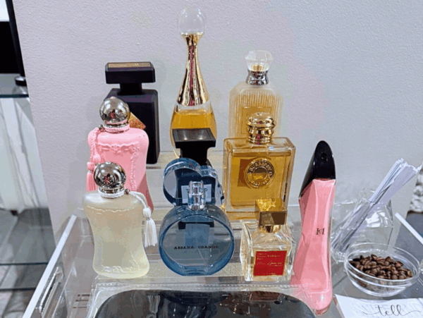 Image of perfume bottles on a stand for a perfume party