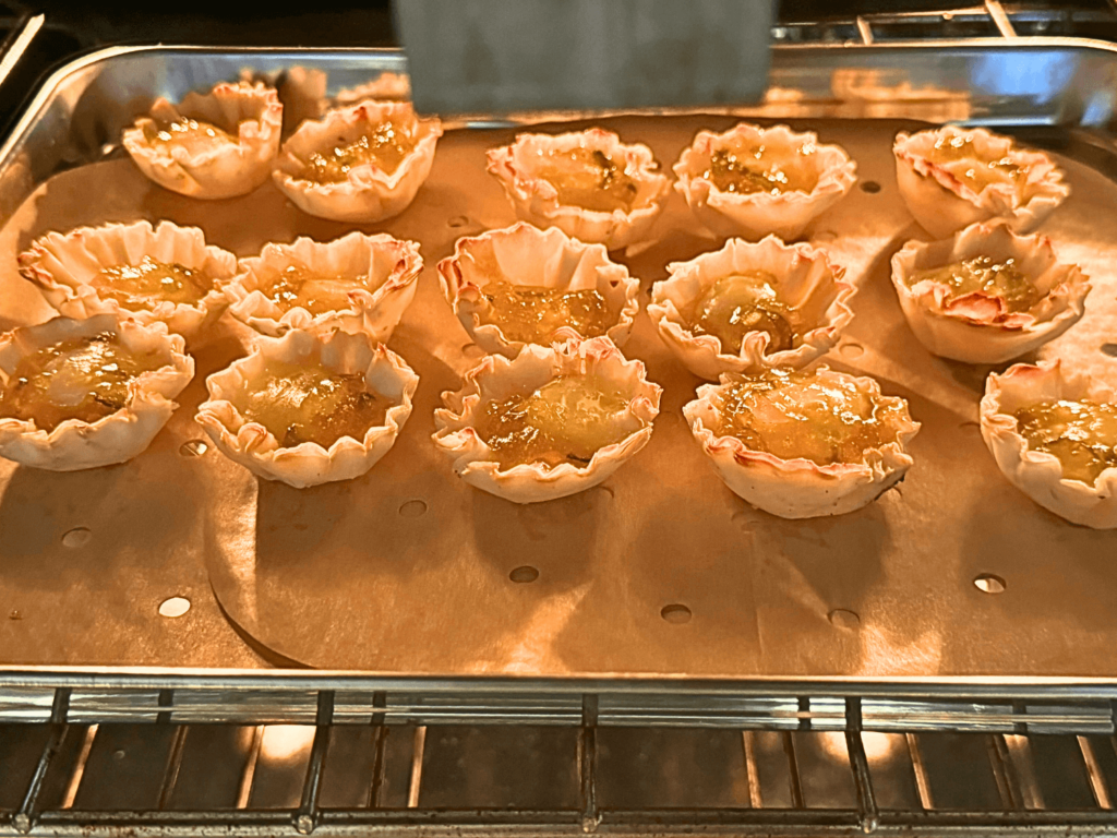 photo of mini baked brie bites baking in the oven