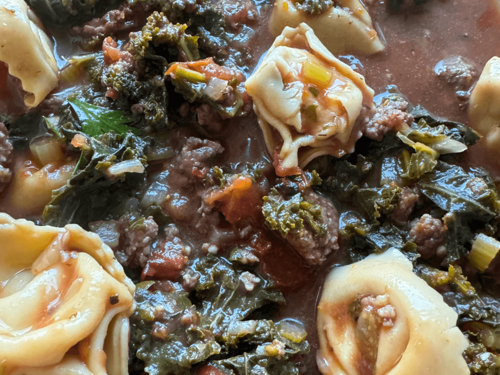 close up photo of tortellini soup