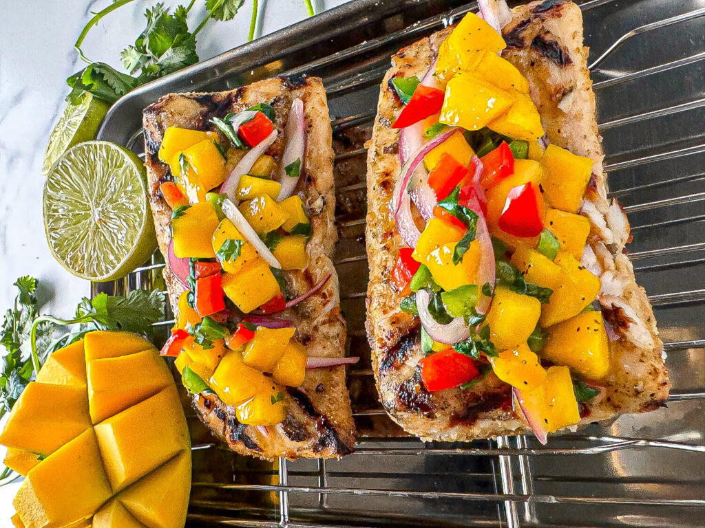 Photo of grilled fish with mango salsa on top