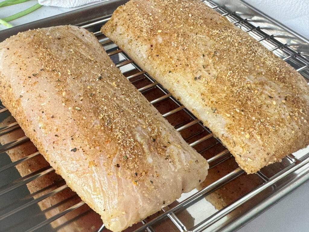 Photo of two seasoned mahi mahi fish