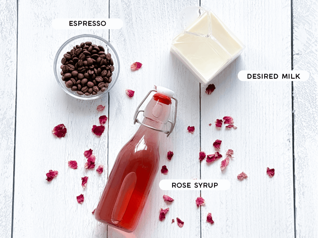 Photo of an iced rose latte ingredients: coffee beans, milk, and rose syrup