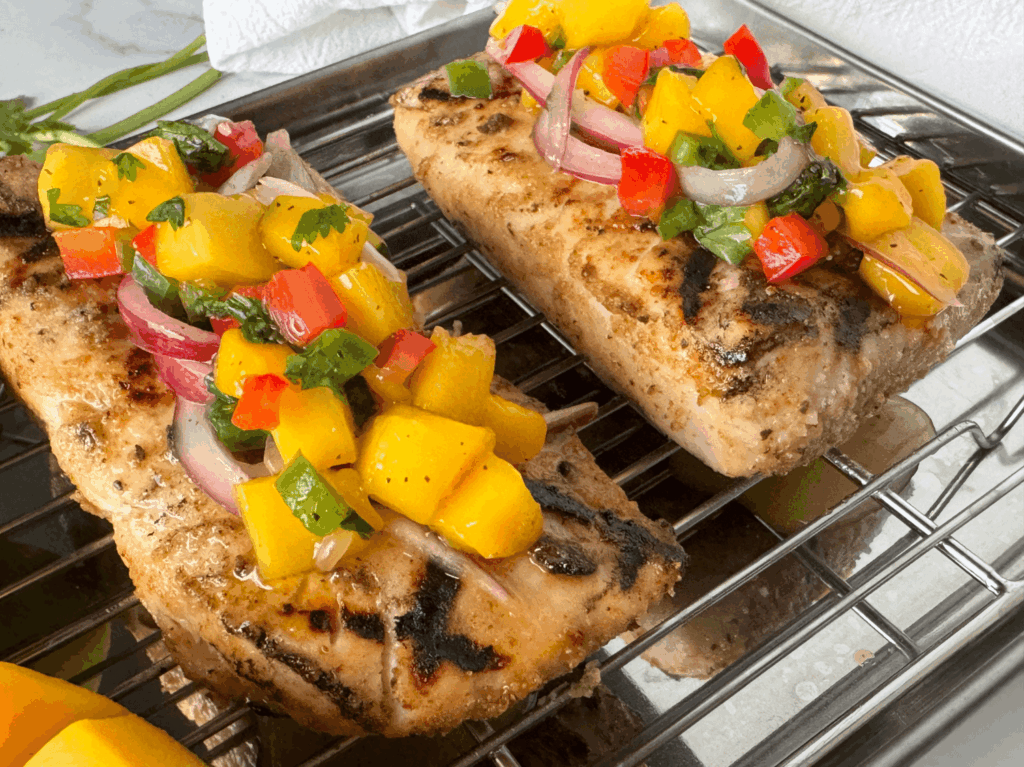 Photo of mango salsa on top of fish