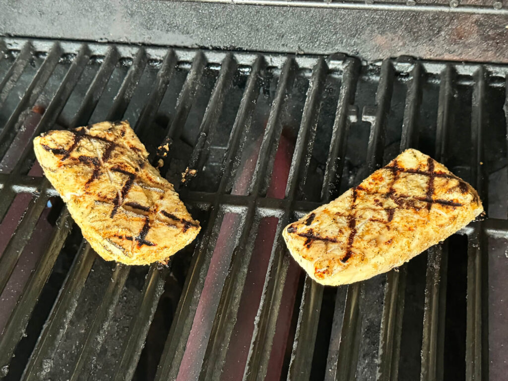 Photo of mahi mahi fish on the grill with grill marks