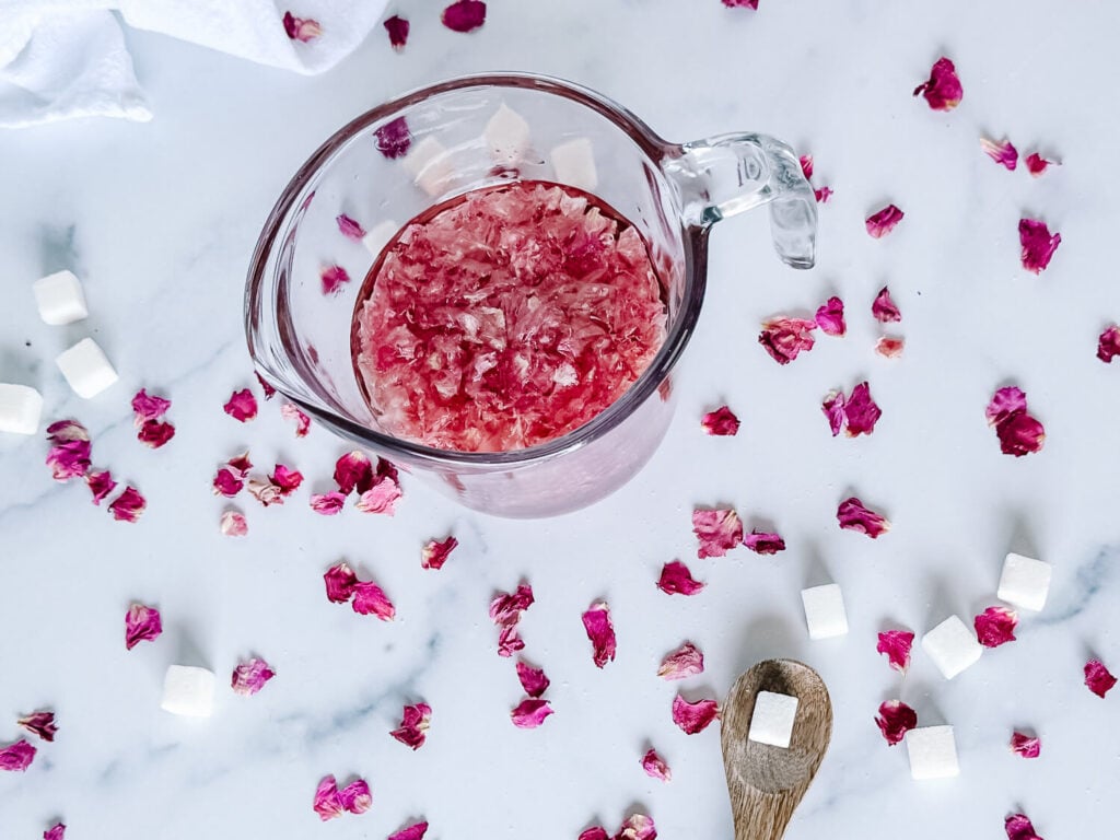 Photo of rose simple syrup cooling in a measuring cup