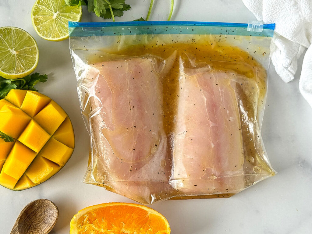 Photo of fish in a bag covered in marinade