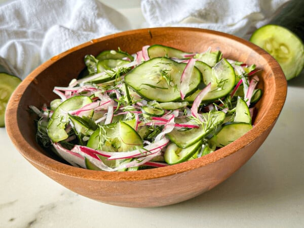 Photo of Cucumber Dill Salad in a wooden bowl