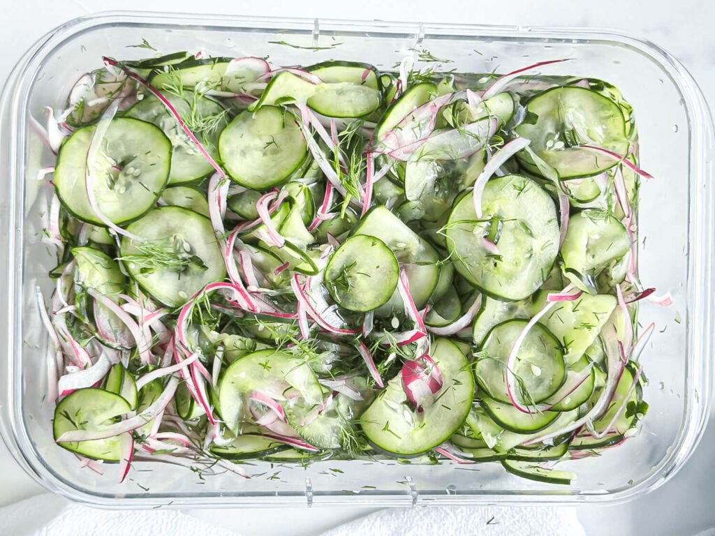 Cucumber dill salad in an airtight container