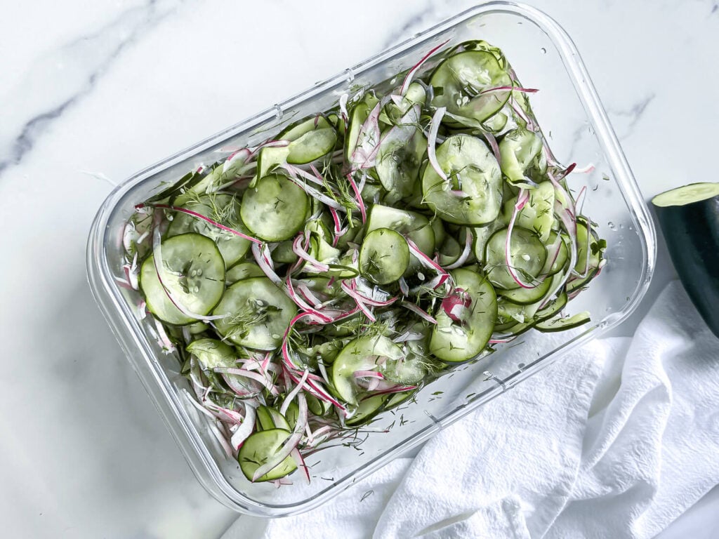 Cucumber dill salad in an airtight container