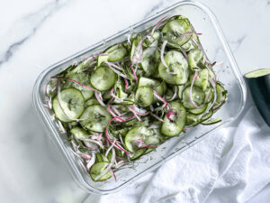 Cucumber dill salad in an airtight container